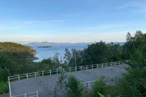 a view of a body of water with a fence at Moldegaard Riding Lodge in Moldegard