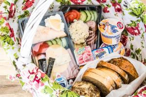 a lunch box filled with different types of food at Willa Bachledówka in Zakopane