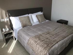 Postel nebo postele na pokoji v ubytování Hotel Inn
