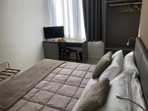 Postel nebo postele na pokoji v ubytování Hotel Inn