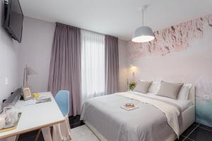 Postel nebo postele na pokoji v ubytování VISIONAPARTMENTS Lucerne - contactless check-in
