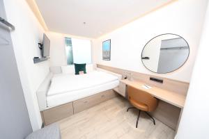 Postel nebo postele na pokoji v ubytování Marlin Hotel Stephens Green