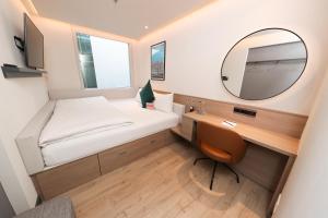 Postel nebo postele na pokoji v ubytování Marlin Hotel Stephens Green