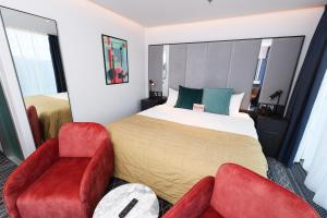 Postel nebo postele na pokoji v ubytování Marlin Hotel Stephens Green