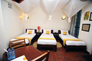 Postel nebo postele na pokoji v ubytování Kenya Comfort Hotel + 37 fotografií