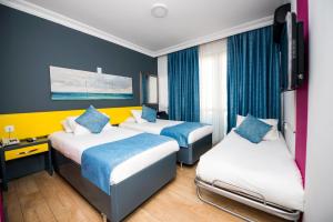 Cama o camas de una habitación en Mera Park Hotel