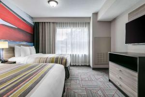 Voodi või voodid majutusasutuse Clarion Pointe Columbus-Bradley Park toas