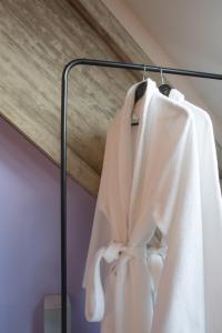 
a white towel hanging from the side of a white wall at Hof Olmenstein in Goes
