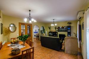a living room with a couch and a table at Casa Rural Las 6 Hermanas in San Martín de Trevejo