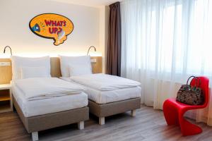 מיטה או מיטות בחדר ב-Comfort Hotel Prague City