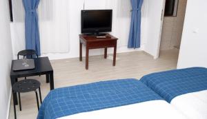 TV a/nebo společenská místnost v ubytování Hotel Road Rooms + 17 fotografií