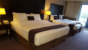 Katil atau katil-katil dalam bilik di Shamrock Lodge Hotel