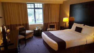 Katil atau katil-katil dalam bilik di Shamrock Lodge Hotel