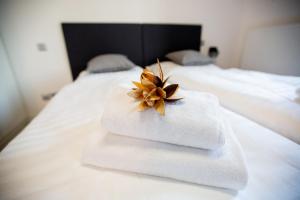 Postel nebo postele na pokoji v ubytování Exclusive penzion Viva Residence