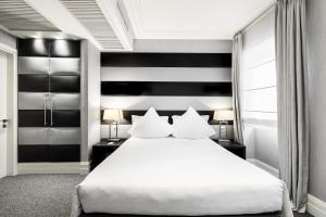 Postel nebo postele na pokoji v ubytování Hotel Mancino 12