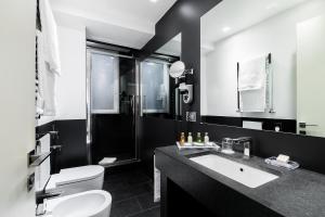 Koupelna v ubytování Hotel Mancino 12