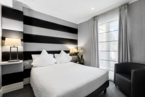 Postel nebo postele na pokoji v ubytování Hotel Mancino 12