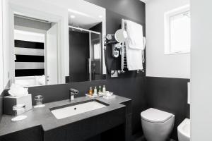 Koupelna v ubytování Hotel Mancino 12