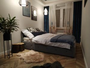 Posteľ alebo postele v izbe v ubytovaní Apartament Skrytka