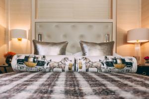 a bedroom with a bed with horses on it at 11 Cadogan Gardens, The Apartments and The Chelsea Townhouse by Iconic Luxury Hotels in London