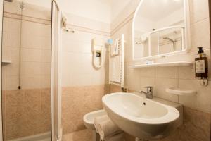 a bathroom with a sink and a shower at Hotel Stella Del Nord in Courmayeur