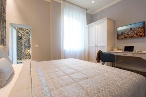 Postel nebo postele na pokoji v ubytování B&B PISTOIA INN