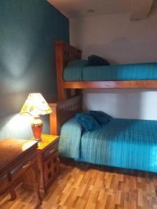 Krevet ili kreveti na kat u jedinici u objektu Hotel Huasca Terrazza