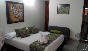 Postel nebo postele na pokoji v ubytování Hotel Mirador Santana