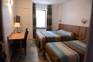 Postel nebo postele na pokoji v ubytování Hôtel du Lion