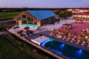 an aerial view of a resort with a swimming pool at Quinta Da Comporta - Wellness Boutique Resort in Comporta