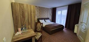 Postel nebo postele na pokoji v ubytování Mon Ami Hotel