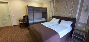 Postel nebo postele na pokoji v ubytování Mon Ami Hotel