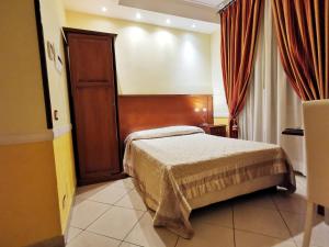 Postel nebo postele na pokoji v ubytování Hotel Valentino Palace