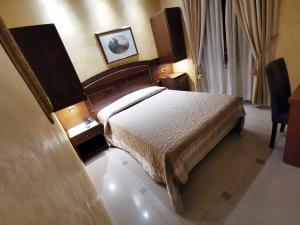 Postel nebo postele na pokoji v ubytování Hotel Valentino Palace