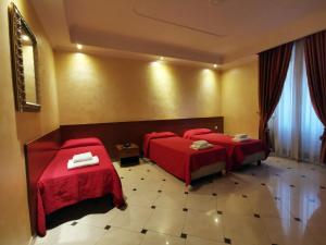 Postel nebo postele na pokoji v ubytování Hotel Valentino Palace