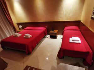 Postel nebo postele na pokoji v ubytování Hotel Valentino Palace