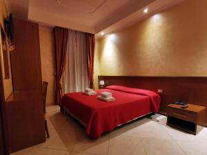 Postel nebo postele na pokoji v ubytování Hotel Valentino Palace