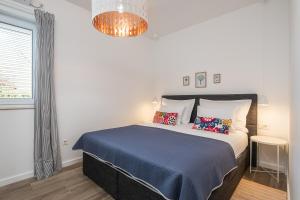 Posteľ alebo postele v izbe v ubytovaní Apartments Villa Maria