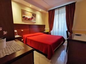 Postel nebo postele na pokoji v ubytování Hotel Valentino Palace