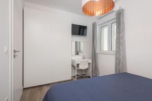 Posteľ alebo postele v izbe v ubytovaní Apartments Villa Maria