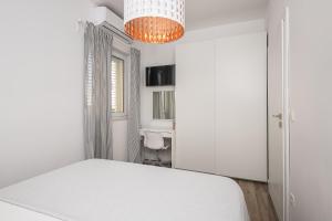 Posteľ alebo postele v izbe v ubytovaní Apartments Villa Maria