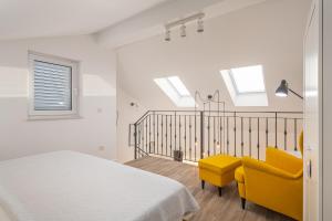 Posteľ alebo postele v izbe v ubytovaní Apartments Villa Maria