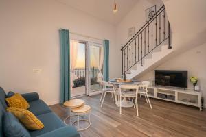 Televízia a/alebo spoločenská miestnosť v ubytovaní Apartments Villa Maria