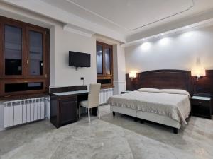 Postel nebo postele na pokoji v ubytování Hotel Valentino Palace