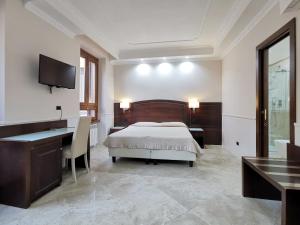 Postel nebo postele na pokoji v ubytování Hotel Valentino Palace