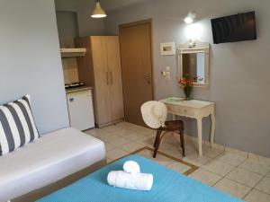 a living room with a couch and a table at Katerina Lefkada in Vasiliki