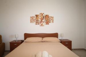 A bed or beds in a room at Villetta Campurè