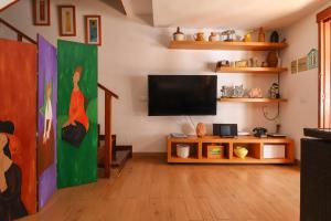 a living room with a flat screen tv at Casa Pepa Agaete in Agaete