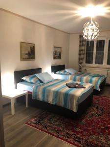מיטה או מיטות בחדר ב-Auszeit; Gästehaus & mehr