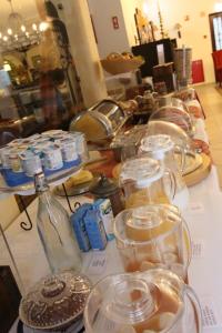 a table with many jars of food on it at Solar de Mos in Lagos